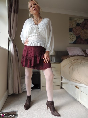 Emerald In Mini Skirt And Stockings 2