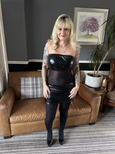 Inked Milf In Shiny Black Dress Stockings And Heels 1